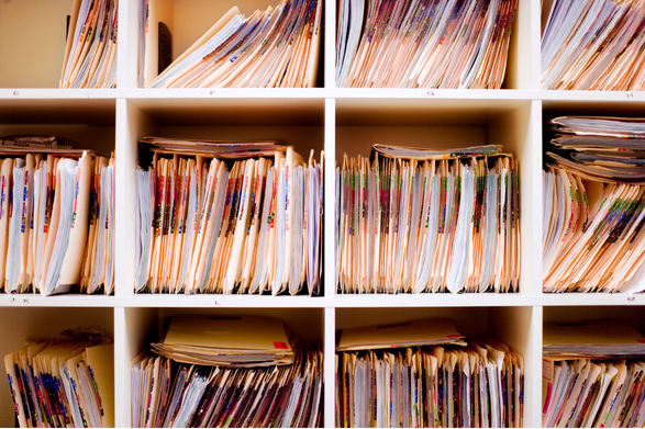 A clean flat-lay of labeled medical folders
